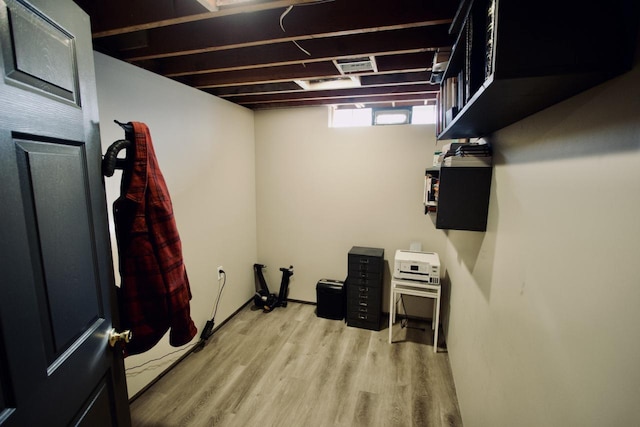 basement featuring light hardwood / wood-style flooring