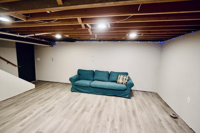 basement featuring light hardwood / wood-style flooring