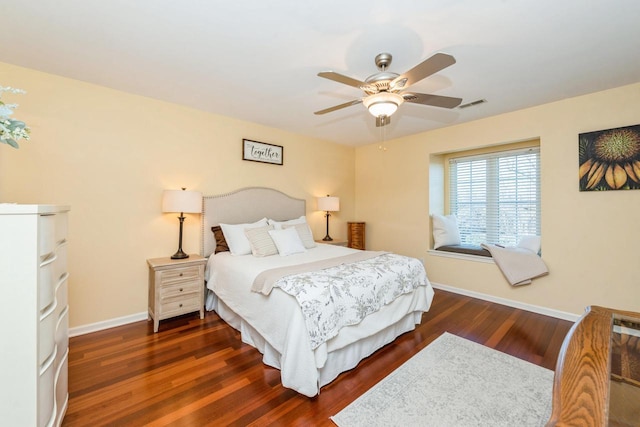 bedroom featuring ceiling fan and dark hardwood / wood-style floors