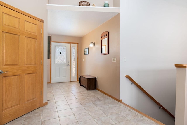 foyer entrance featuring light tile patterned flooring