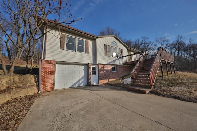 view of front of house with a wooden deck and a garage