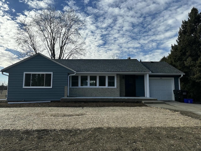 ranch-style house featuring a garage