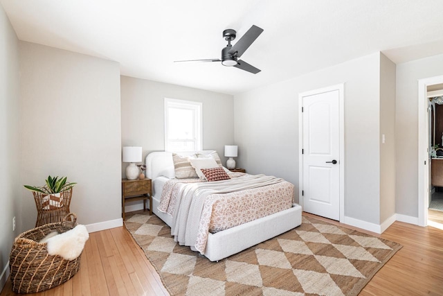 bedroom featuring ceiling fan and light hardwood / wood-style flooring