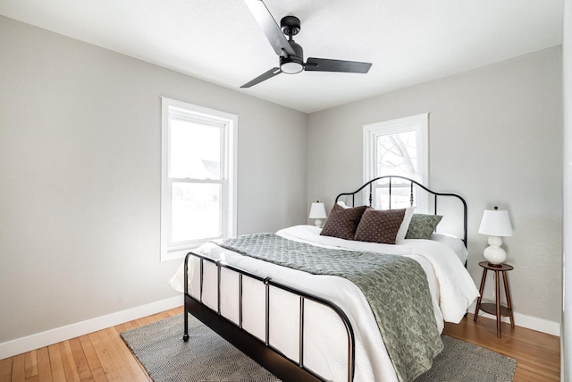 bedroom with hardwood / wood-style floors and ceiling fan