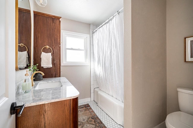 full bathroom featuring shower / tub combo with curtain, vanity, toilet, and tile patterned flooring