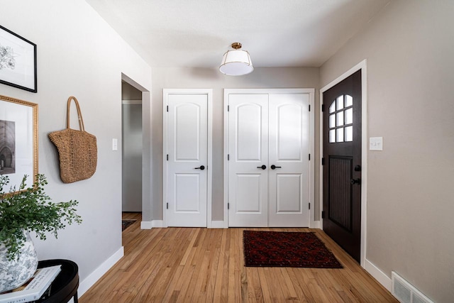 foyer with light hardwood / wood-style floors