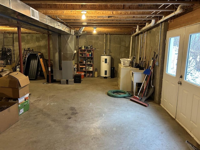 basement featuring electric water heater and heating unit