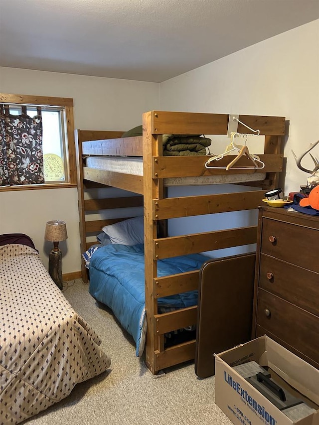 bedroom with light colored carpet