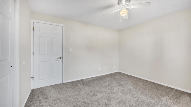 empty room with carpet flooring and ceiling fan