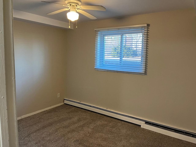 carpeted spare room featuring a baseboard heating unit and ceiling fan