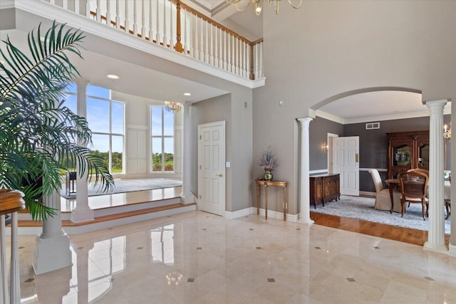 N84W36411 Riverwood Ln, Oconomowoc, WI 53066 - foyer with a high ceiling, an inviting chandelier, and ornate columns