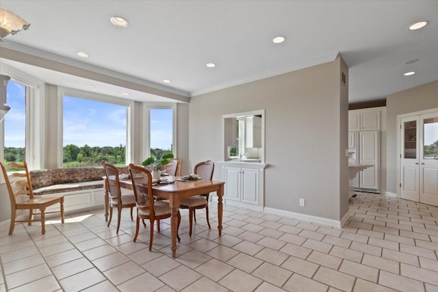 N84W36411 Riverwood Ln, Oconomowoc, WI 53066 - dining room featuring light tile patterned floors and crown molding
