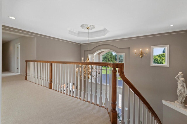 N84W36411 Riverwood Ln, Oconomowoc, WI 53066 - hall with an inviting chandelier, crown molding, carpet floors, and a tray ceiling