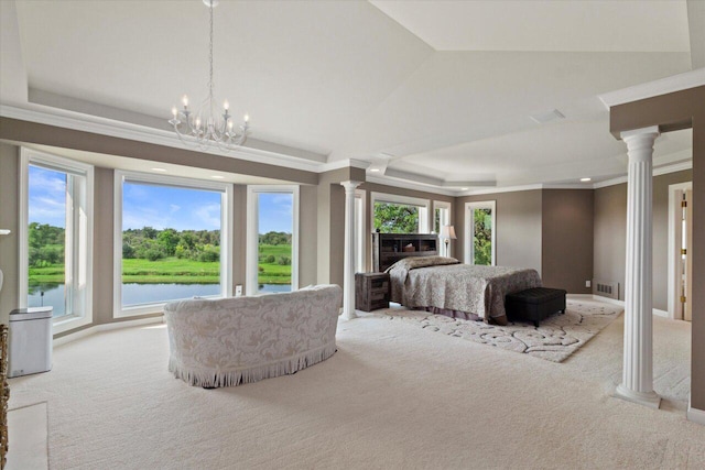 N84W36411 Riverwood Ln, Oconomowoc, WI 53066 - carpeted bedroom with a notable chandelier, decorative columns, a water view, and multiple windows