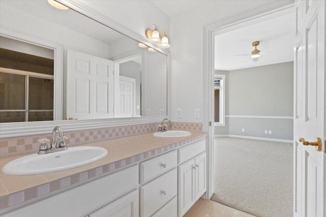 N84W36411 Riverwood Ln, Oconomowoc, WI 53066 - bathroom with tasteful backsplash, vanity, ceiling fan, and tile patterned flooring