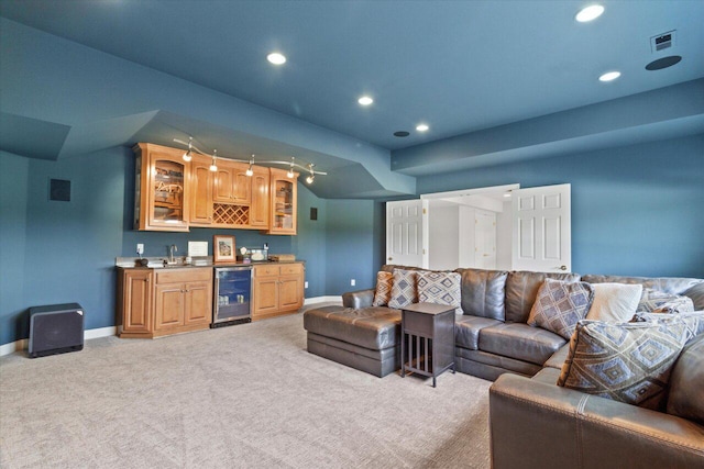 N84W36411 Riverwood Ln, Oconomowoc, WI 53066 - living room featuring light carpet, beverage cooler, wet bar, and lofted ceiling