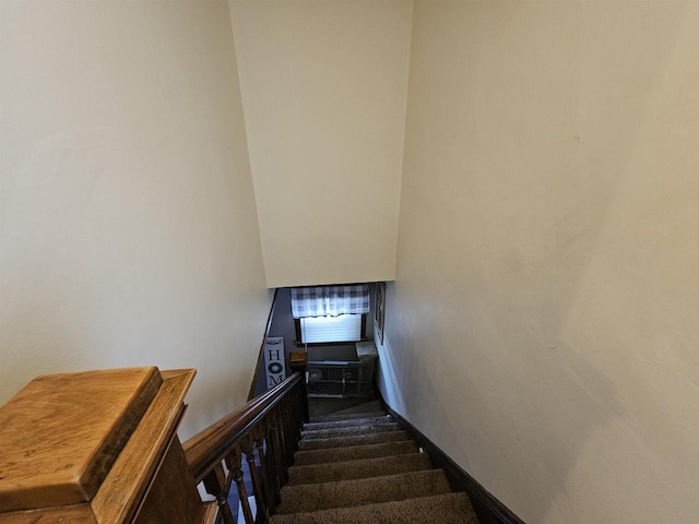 staircase featuring baseboards