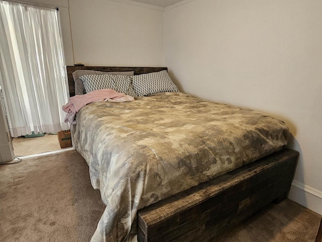 bedroom with carpet and crown molding