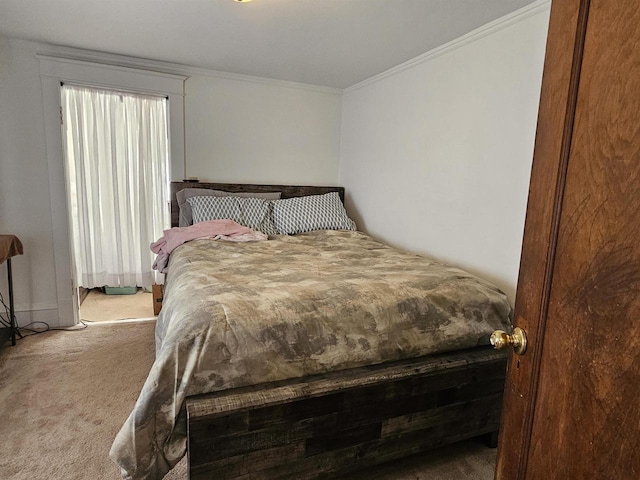 bedroom featuring carpet floors and crown molding