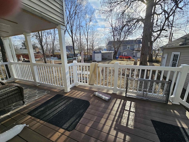 wooden terrace with an outbuilding