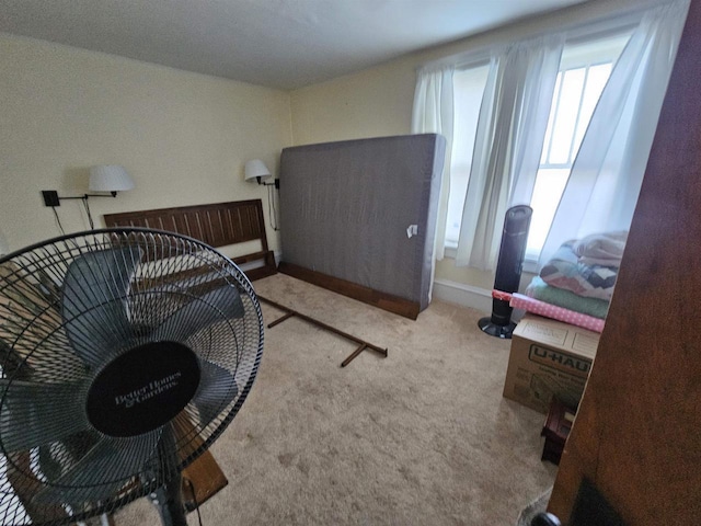 bedroom with carpet flooring and baseboards