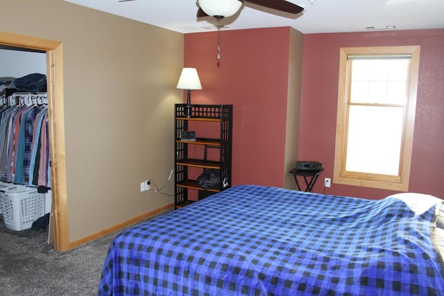 bedroom with ceiling fan, a closet, and carpet