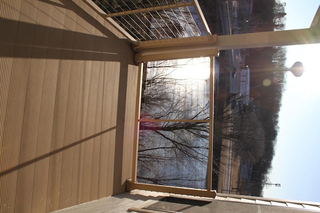 entryway featuring wooden walls