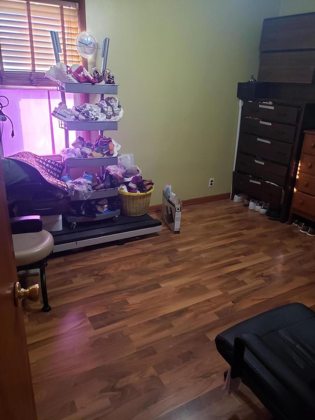 bedroom with dark wood-type flooring