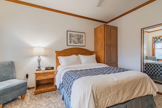 carpeted bedroom featuring ceiling fan and ornamental molding