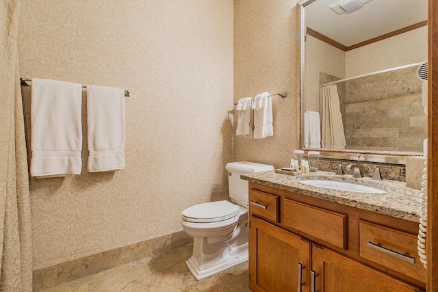 bathroom featuring toilet, ornamental molding, walk in shower, and vanity