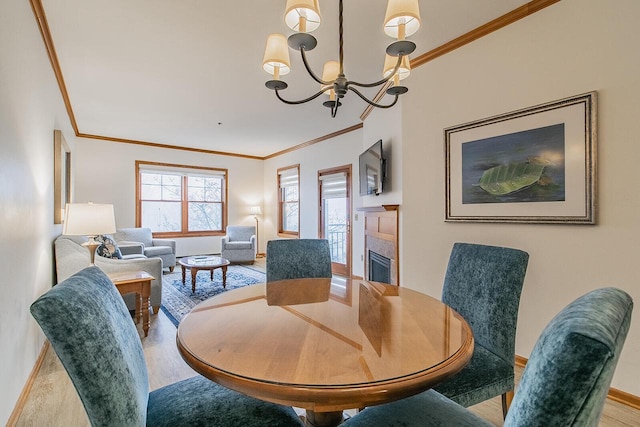 dining space with a notable chandelier and crown molding