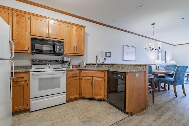 kitchen featuring light stone countertops, black appliances, decorative light fixtures, sink, and a chandelier