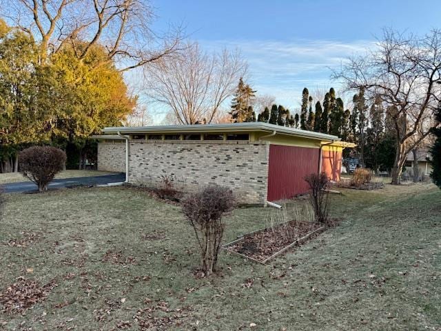 view of outbuilding with a lawn