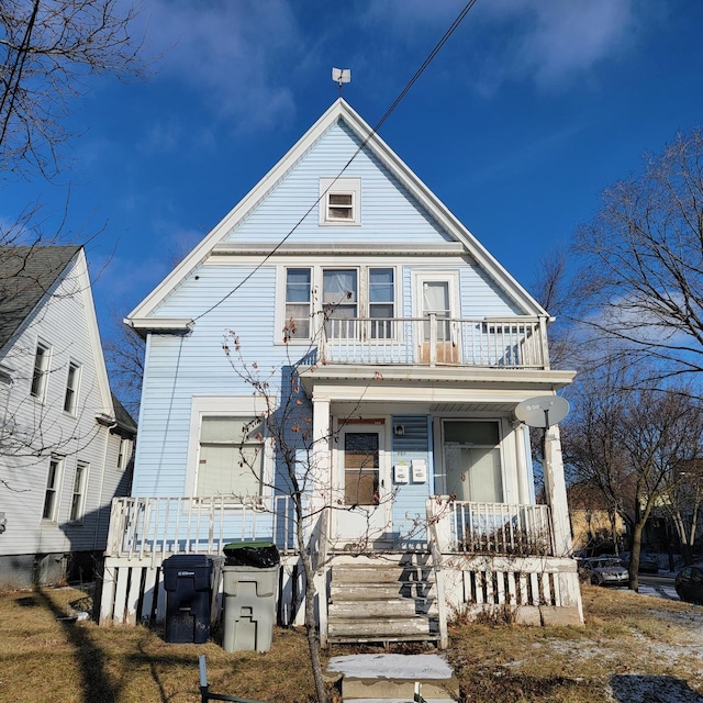 view of front facade featuring covered porch and a balcony