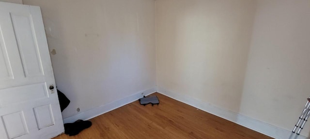 laundry area with light hardwood / wood-style floors