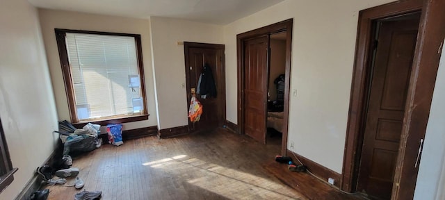 corridor featuring hardwood / wood-style flooring