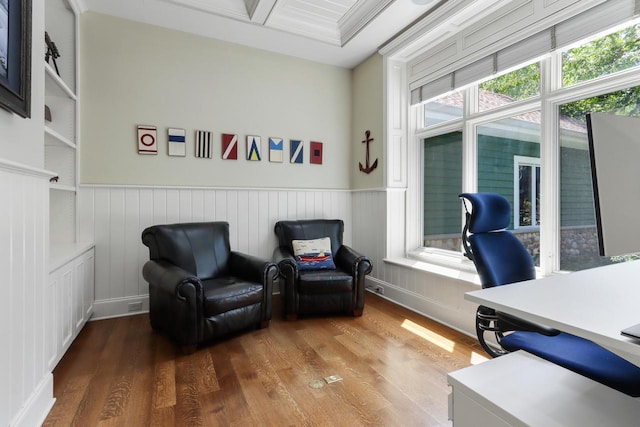 home office with built in features and wood-type flooring