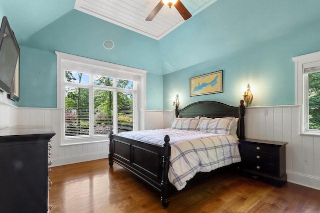 bedroom featuring ceiling fan, vaulted ceiling, and dark hardwood / wood-style floors