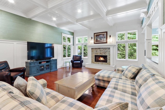 living room with beam ceiling, ornamental molding, coffered ceiling, and hardwood / wood-style floors