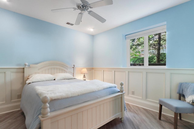 bedroom featuring ceiling fan and wood-type flooring