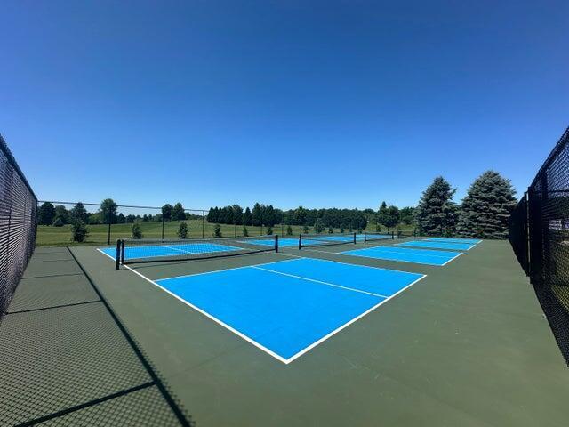 view of sport court with basketball hoop