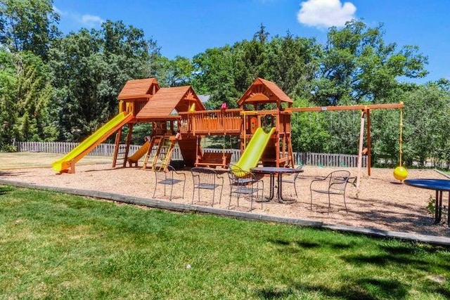 view of jungle gym with a lawn