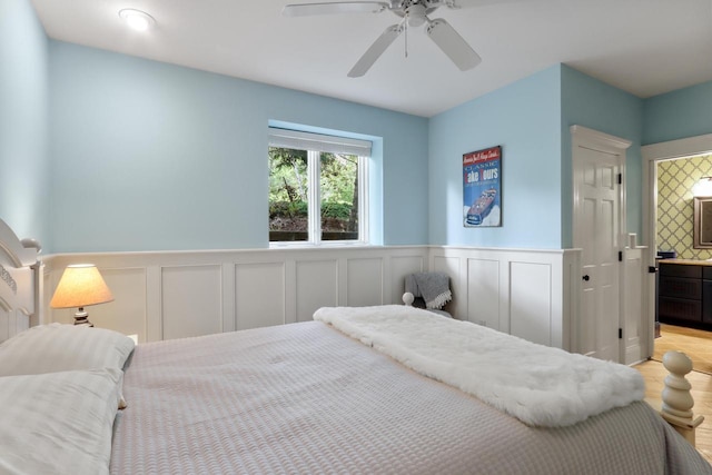 bedroom with ceiling fan and connected bathroom