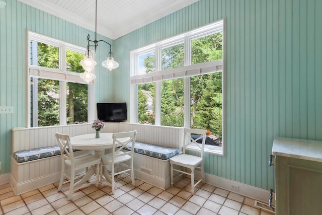 sunroom featuring breakfast area