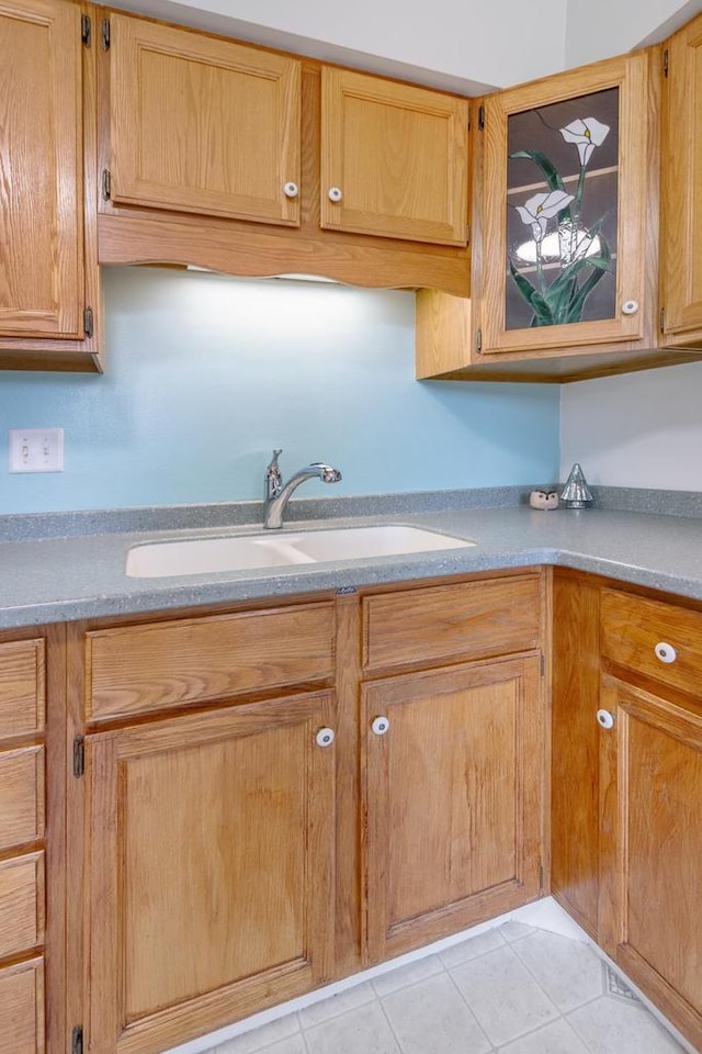 kitchen featuring sink and light tile patterned floors