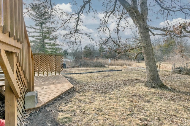 view of yard featuring a wooden deck