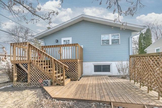 rear view of property with a wooden deck