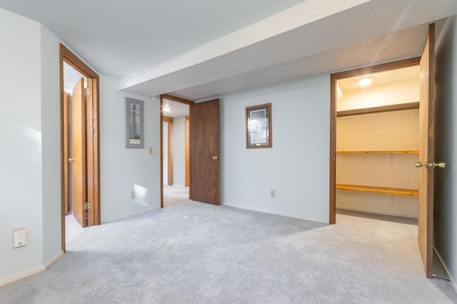 unfurnished room featuring light colored carpet