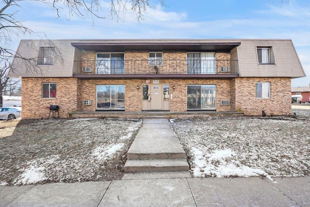 view of front of property with a balcony