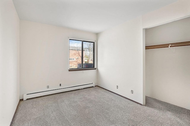 unfurnished bedroom featuring light carpet, a closet, and a baseboard radiator